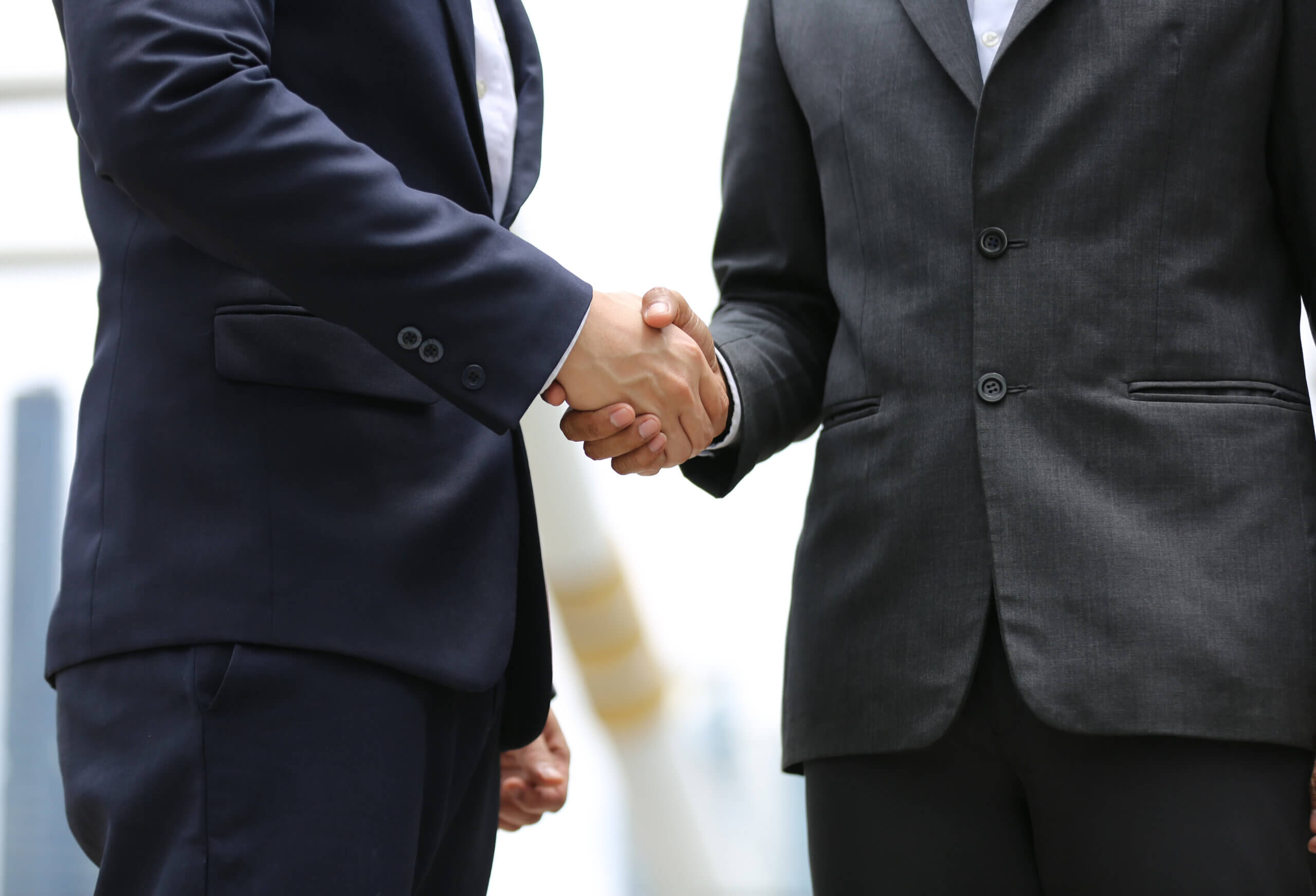 Business partnership handshake